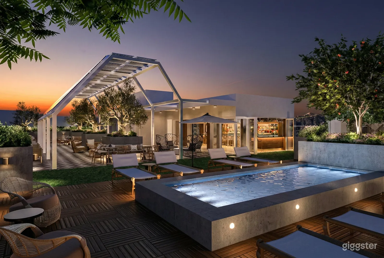 An exquisite rooftop area with various seating areas, an indoor bar, and a large outdoor pool.