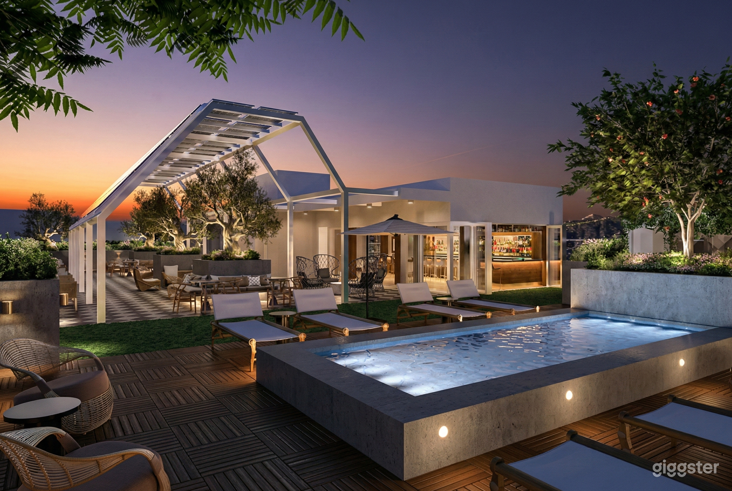 A large home in a rooftop setting with a pool, lounge chairs and dinner seating in the background.