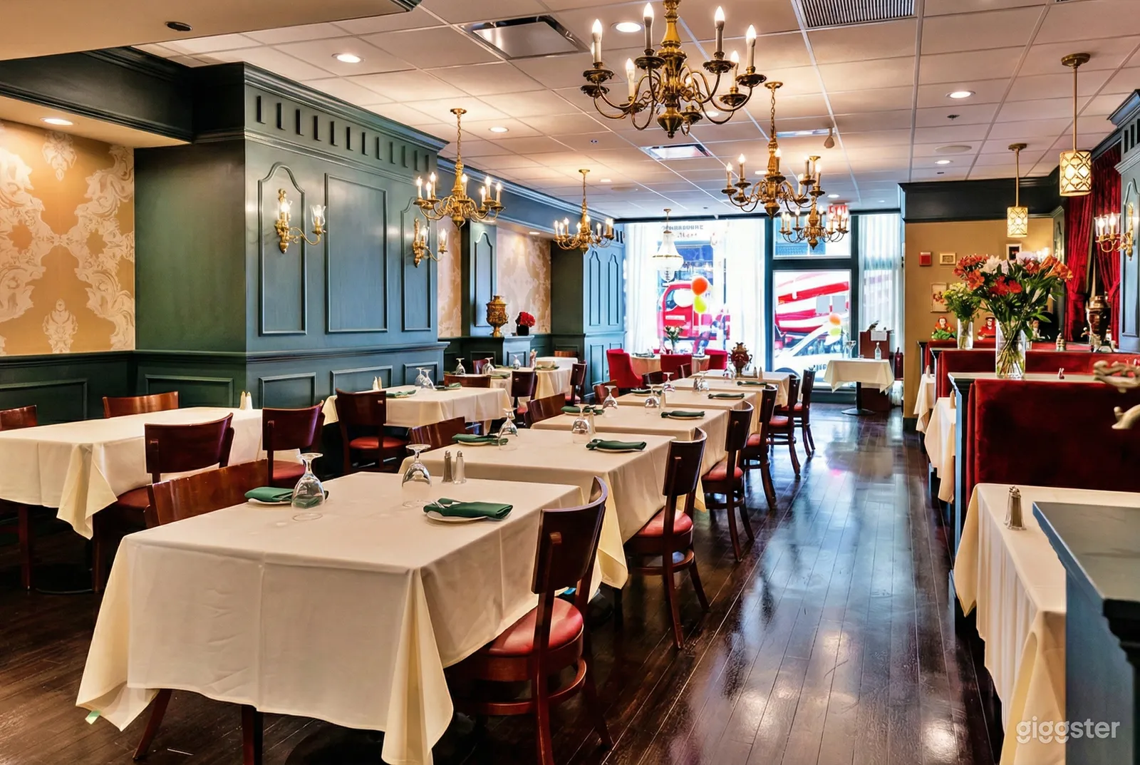 Multiple decorated tables fill a bright room in preparation for an 18th birthday party.